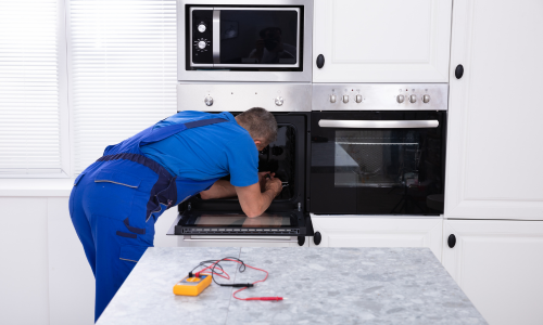 Technician working on oven